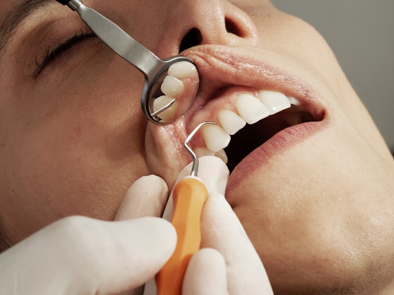 Dental professional smiling in a clinical setting